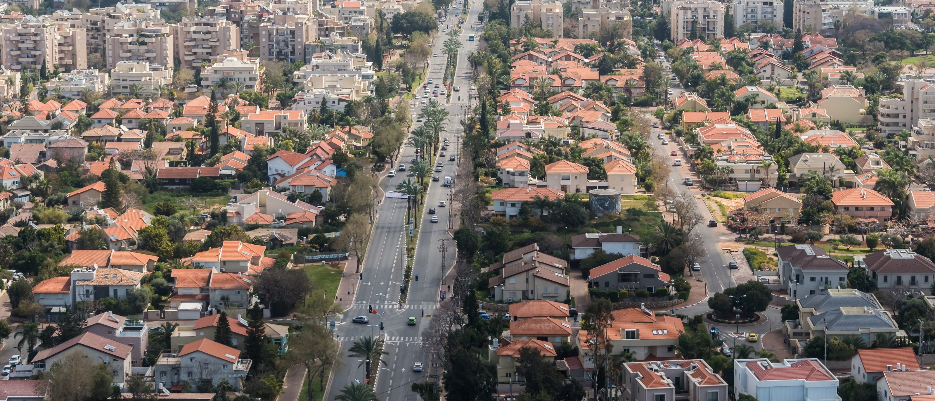 Ra'anana from the air: Ahuza Street runs between streets of red-roofed houses and low apartment blocks